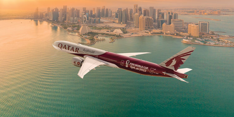 Qatar Airways Airplane Flying over a city