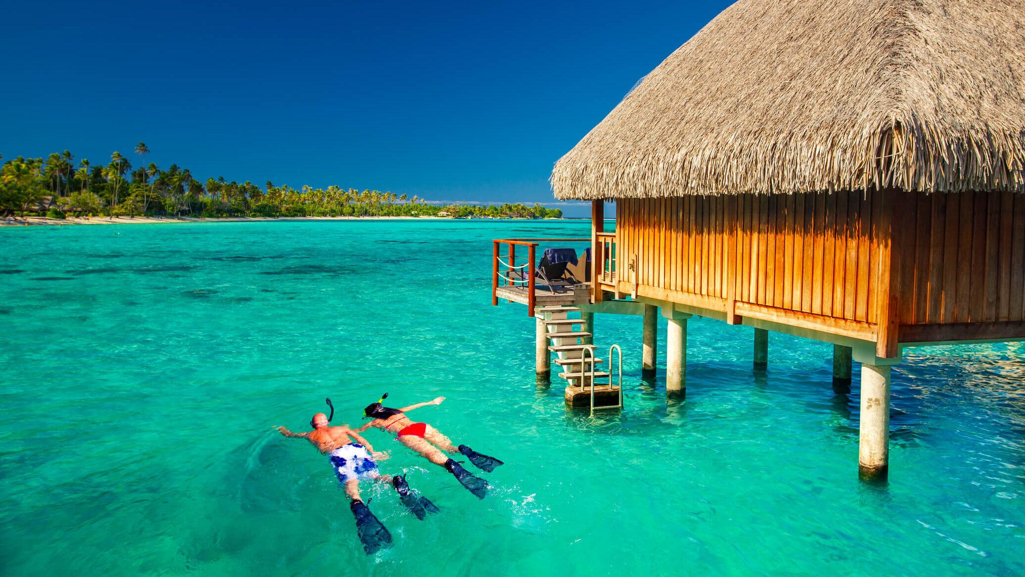 Maldives couple snorkelling