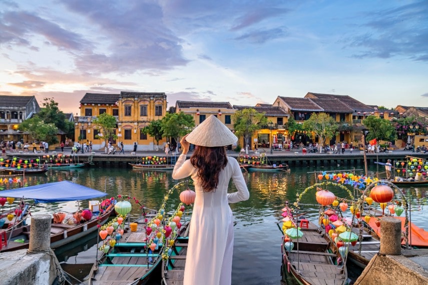 Woman wearing traditional dress at Hoi An, Vietnam in May